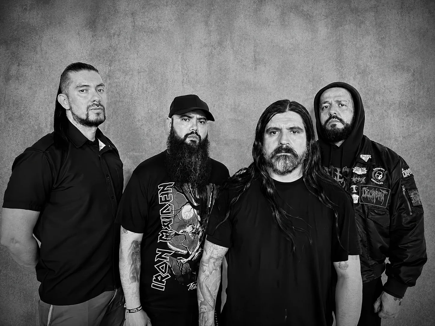 Deformity band members posing in black and white promo photo, 2026